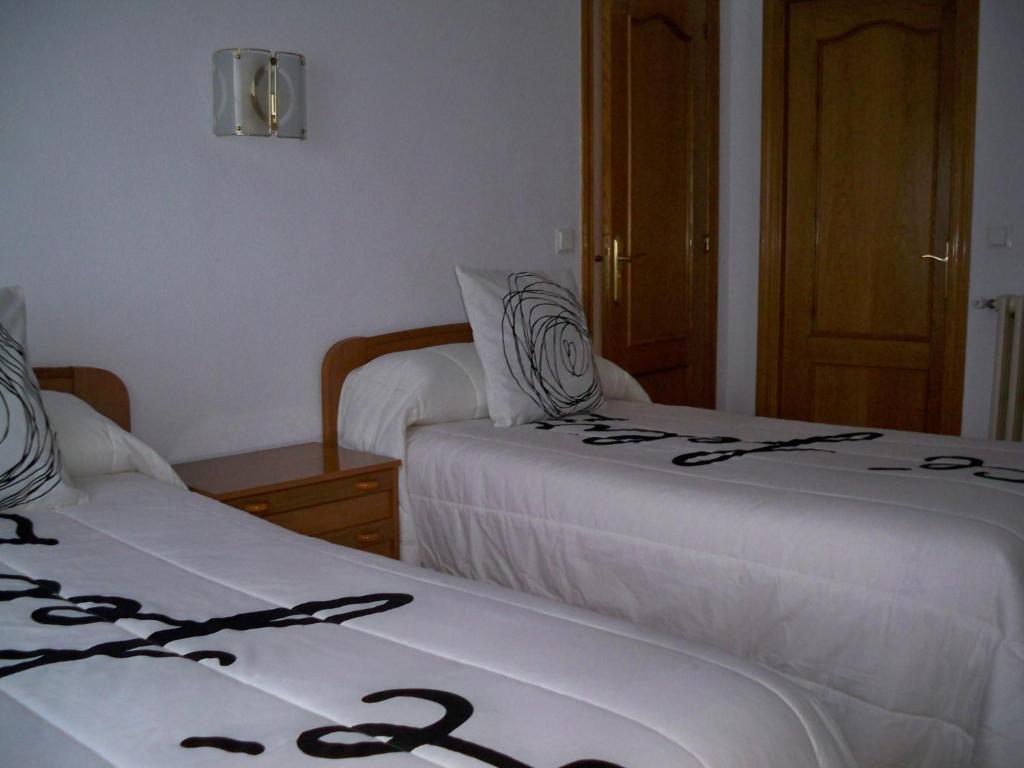 Postel nebo postele na pokoji v ubytování Hostal "Los Chanos el Ruso"