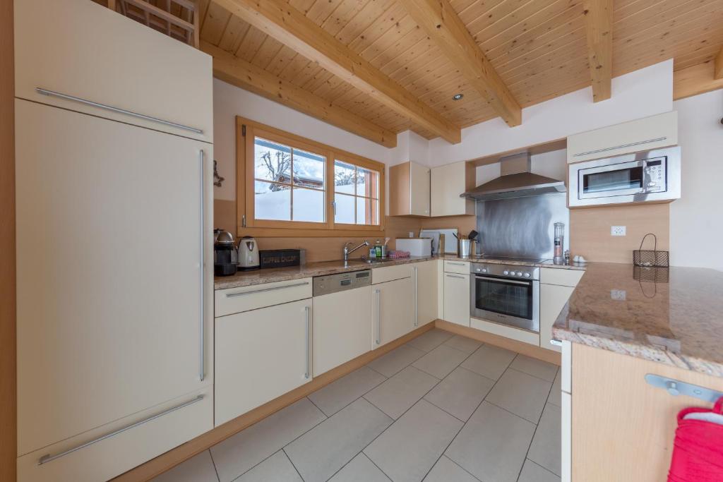 Kuchyň nebo kuchyňský kout v ubytování Chalet Nid Blanc
