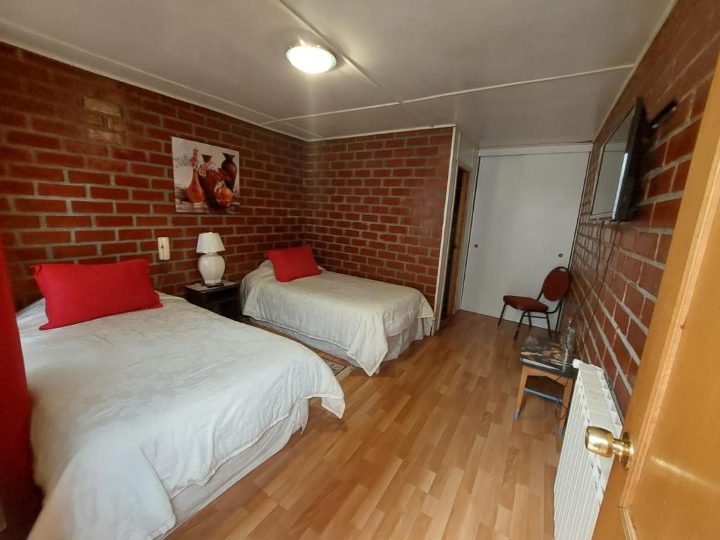 Postel nebo postele na pokoji v ubytování Hostal de la Avenida