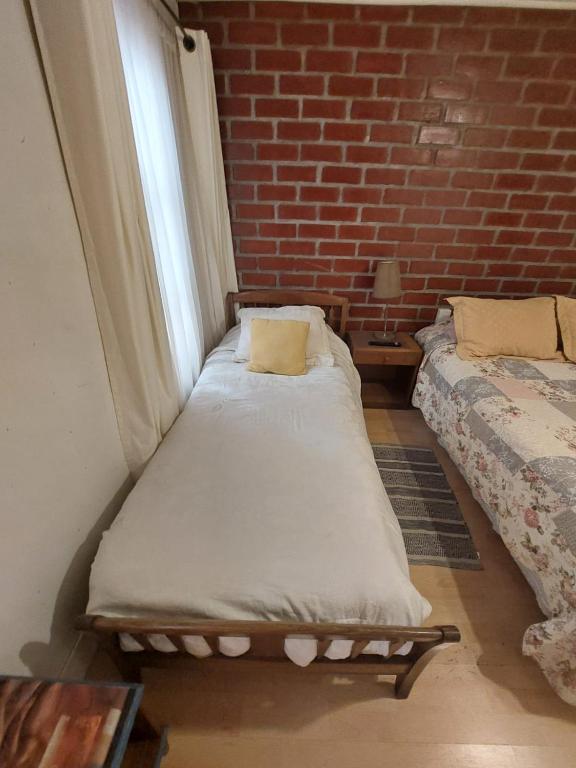Postel nebo postele na pokoji v ubytování Hostal de la Avenida