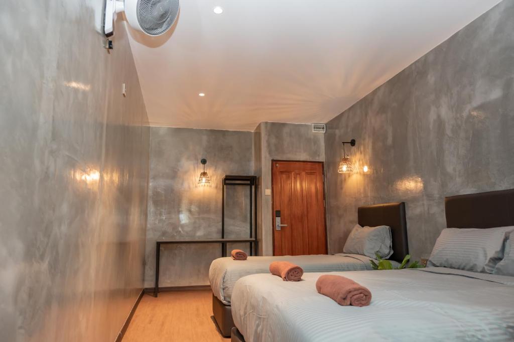 Postel nebo postele na pokoji v ubytování Bricks Guesthouse