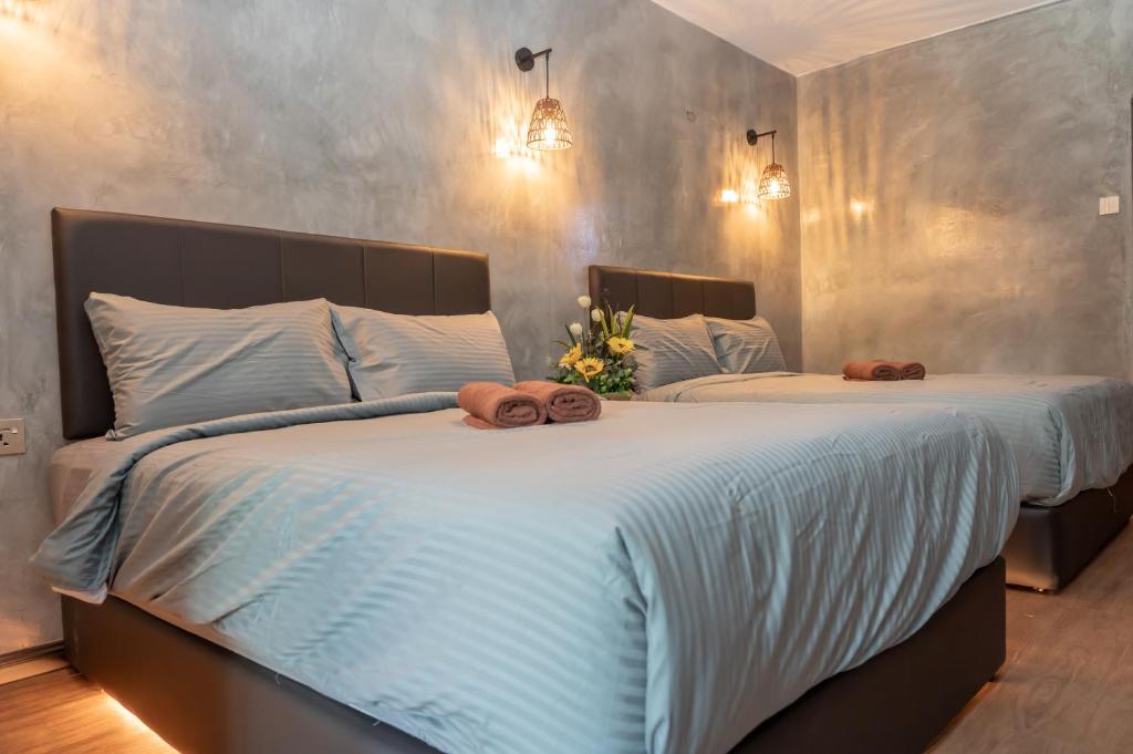 Postel nebo postele na pokoji v ubytování Bricks Guesthouse
