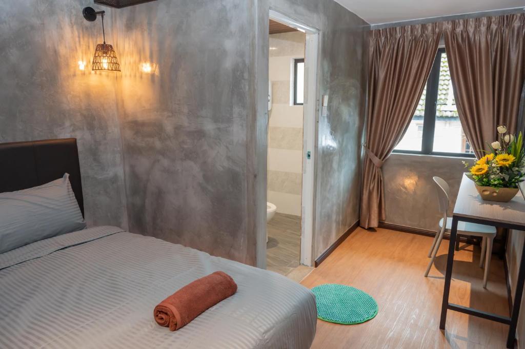Postel nebo postele na pokoji v ubytování Bricks Guesthouse