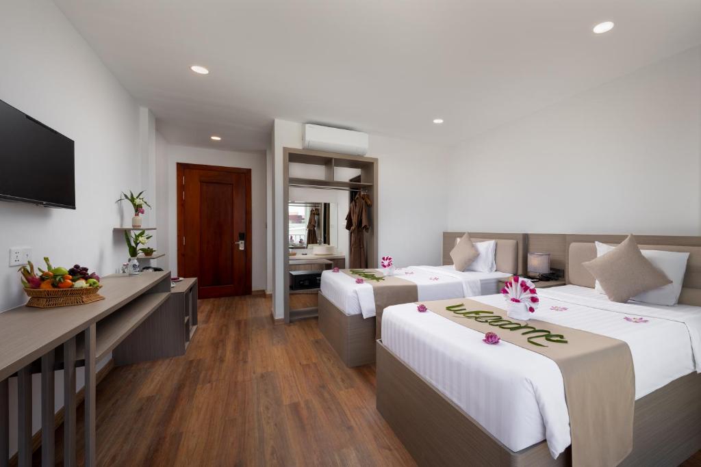 Postel nebo postele na pokoji v ubytování SIEM REAP RIVER VIEW Residence
