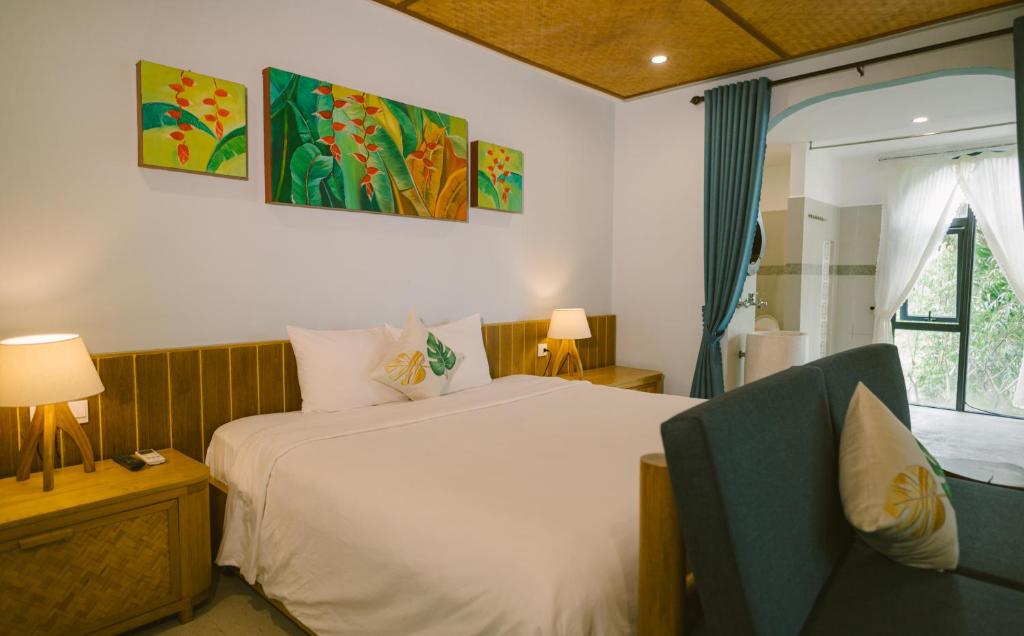 Postel nebo postele na pokoji v ubytování Villa De Campagne Hoi An