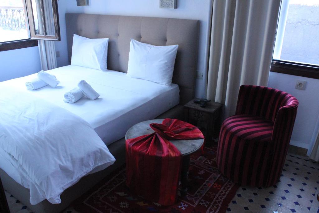 Postel nebo postele na pokoji v ubytování Riad Zaitouna Chaouen
