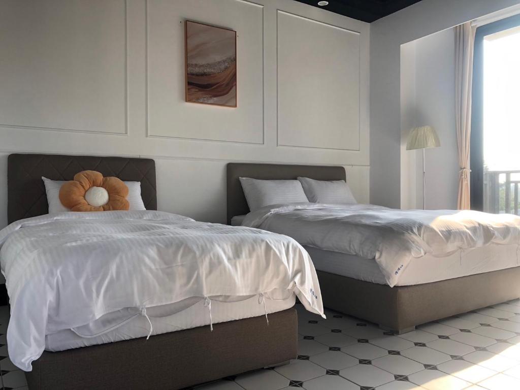 Letto o letti in una camera di Stroll at Wudao Inn