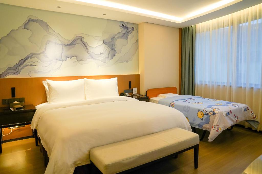 Postel nebo postele na pokoji v ubytování Foreign Trade Centre C&D Hotel,Fuzhou