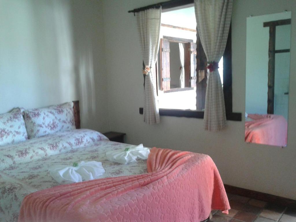 Postel nebo postele na pokoji v ubytování Pousada Aloes