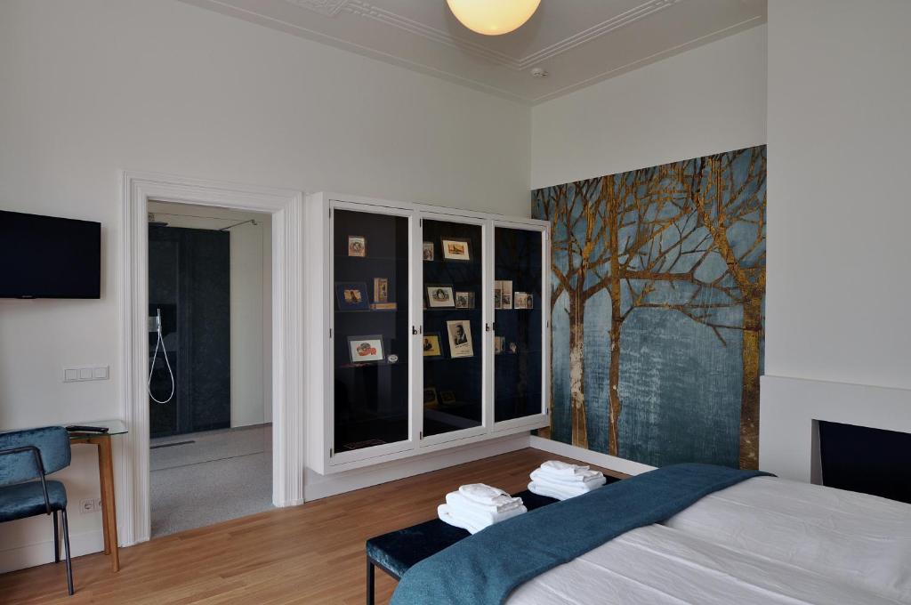 Een bed of bedden in een kamer bij Boetiek Hotel Kampen