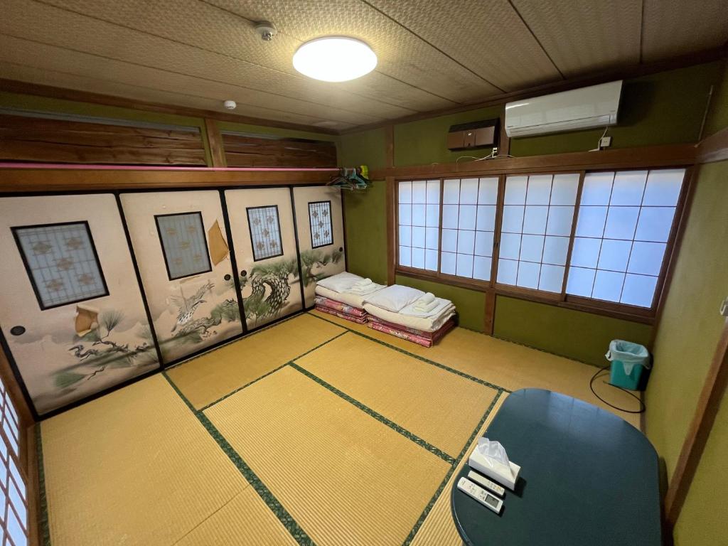 Postel nebo postele na pokoji v ubytování ふる里 Mt Fuji Inn Furusato
