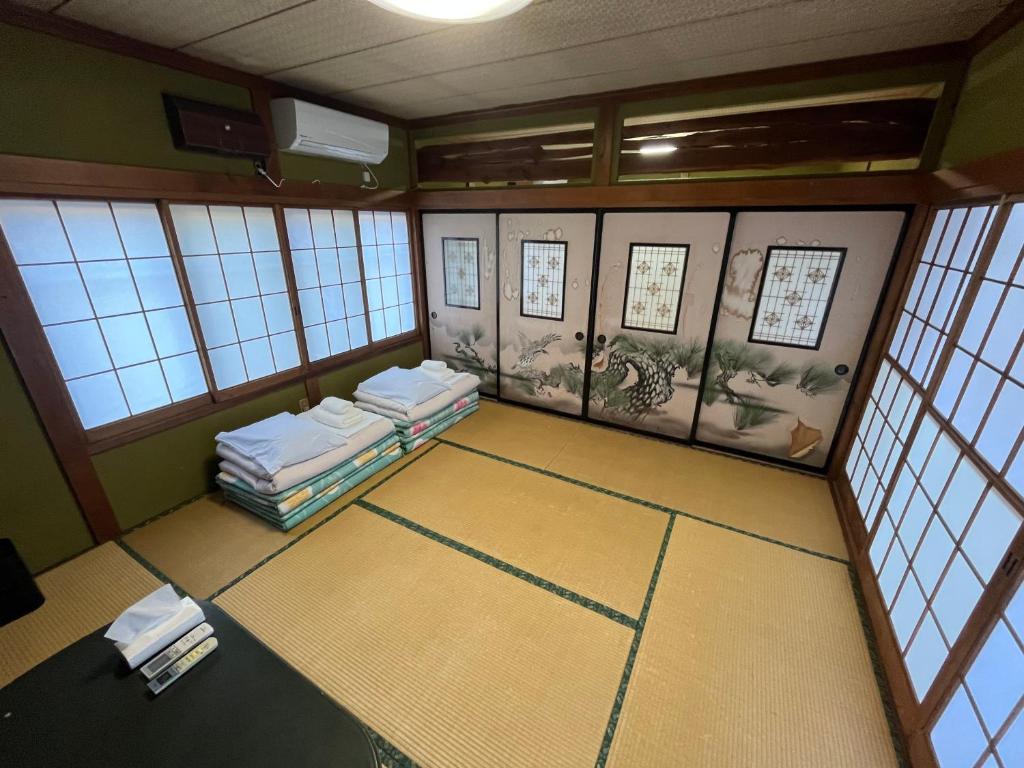 Postel nebo postele na pokoji v ubytování ふる里 Mt Fuji Inn Furusato