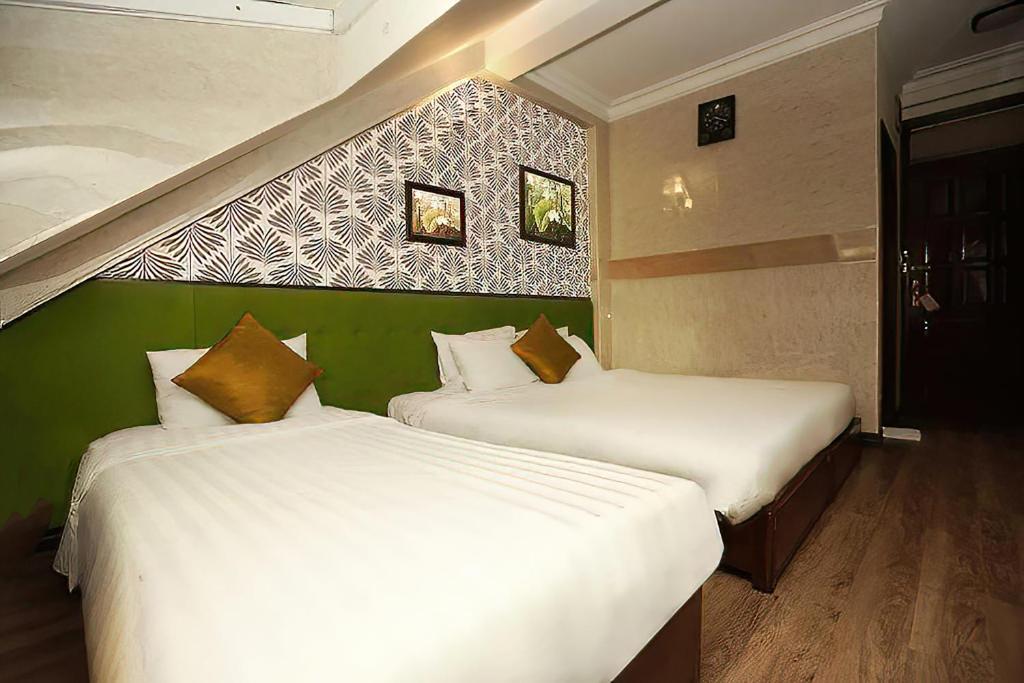 Postel nebo postele na pokoji v ubytování Hanoi Gia Thịnh Hotel & Travel