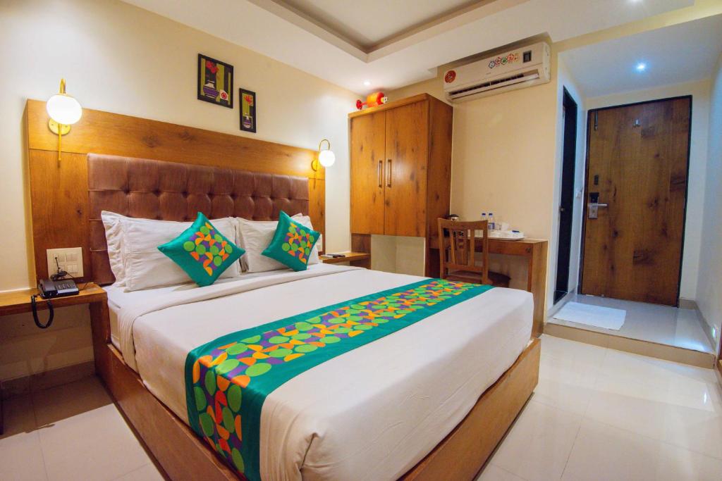 a bedroom with a large bed in a room at Treebo Anam International in Mumbai