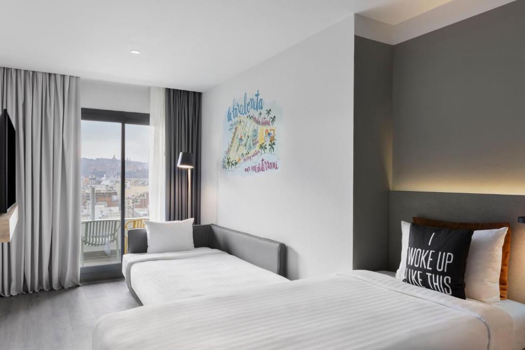 Posteľ alebo postele v izbe v ubytovaní Moxy Barcelona