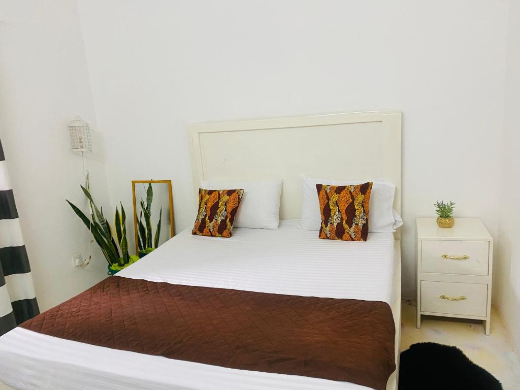 Postel nebo postele na pokoji v ubytování Mkayamba House