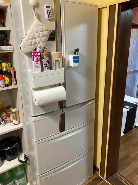 Kuchyň nebo kuchyňský kout v ubytování Hostel Blue Door ホステル ブルードア