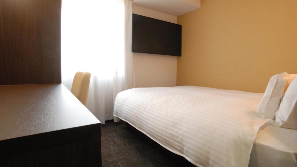 Letto o letti in una camera di AB Hotel Kakamigahara