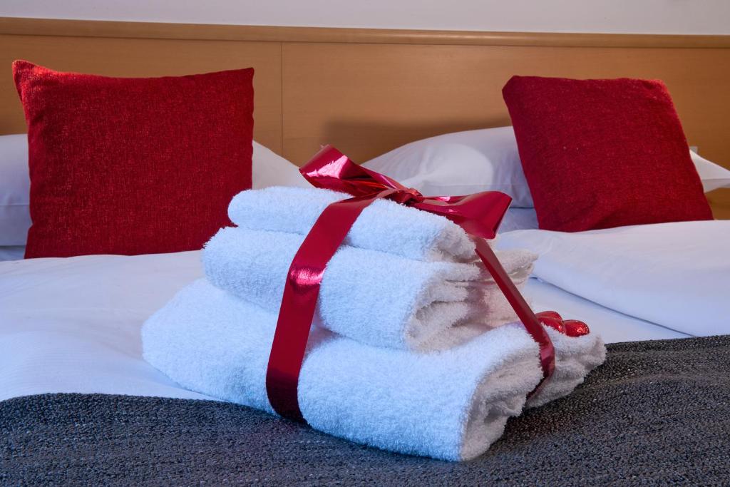 Postel nebo postele na pokoji v ubytování GH Hotel Piaz