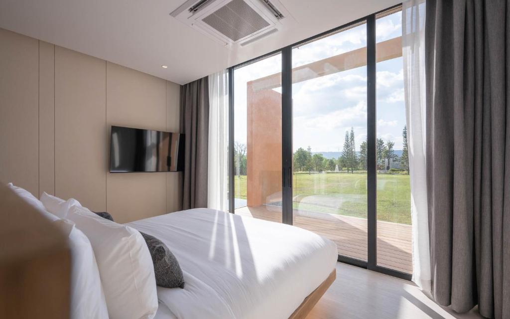 Postel nebo postele na pokoji v ubytování De Capoc Resort