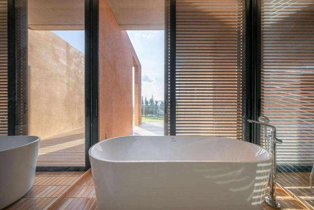 Koupelna v ubytování De Capoc Resort