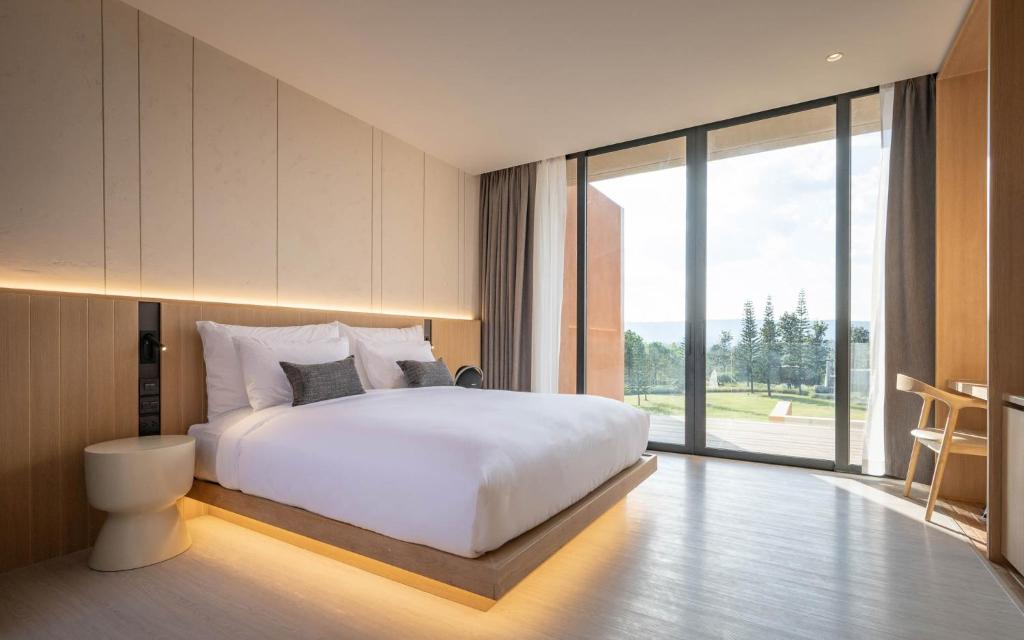 Postel nebo postele na pokoji v ubytování De Capoc Resort