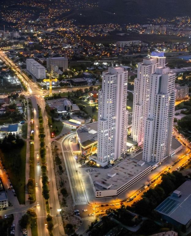 an aerial view of a city at night at Amelie's Apartment 2 in Skopje