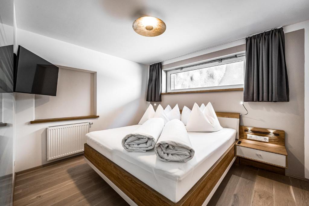 Posteľ alebo postele v izbe v ubytovaní Sonnalp Residences