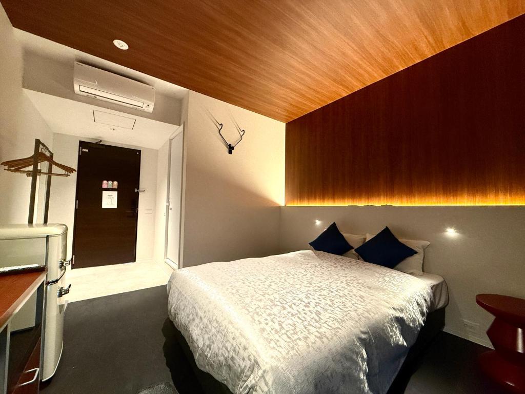 Bakery Hotel SHIRAHAMA ベーカリーホテル シラハマにあるベッド