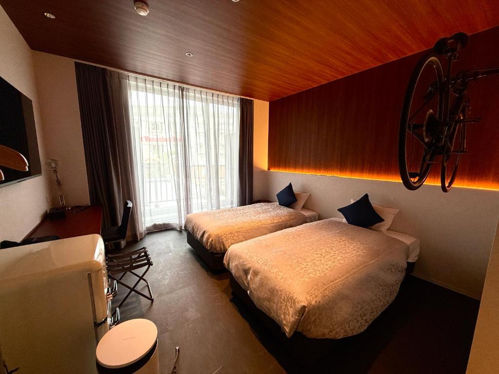Bakery Hotel SHIRAHAMA ベーカリーホテル シラハマにあるベッド