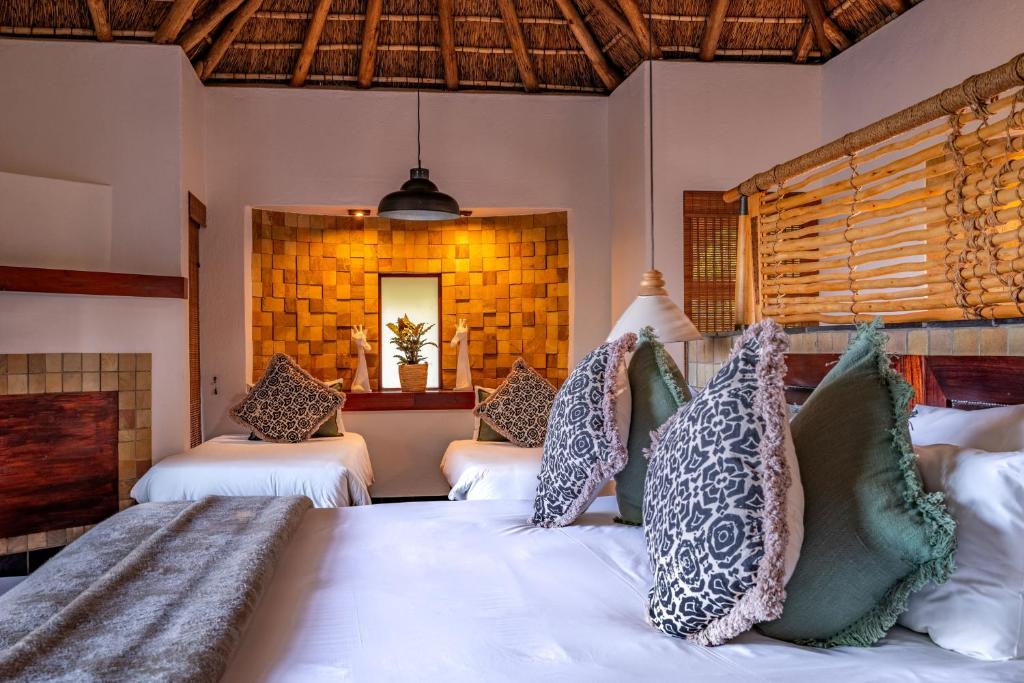 Letto o letti in una camera di Muluwa Lodge