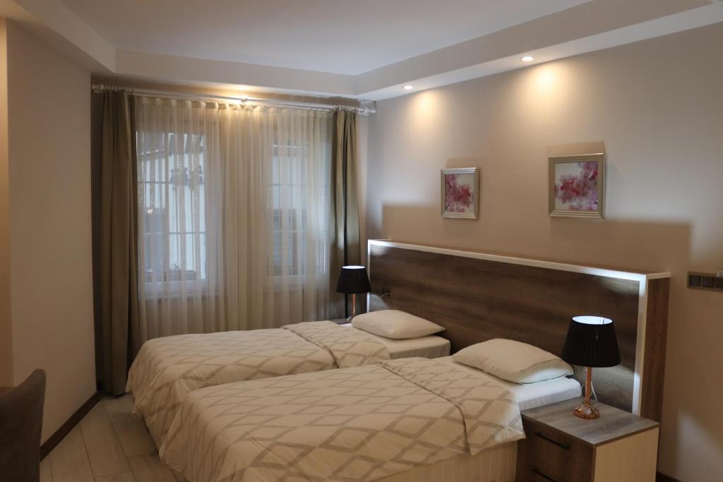 Кровать или кровати в номере Yankı Hotel