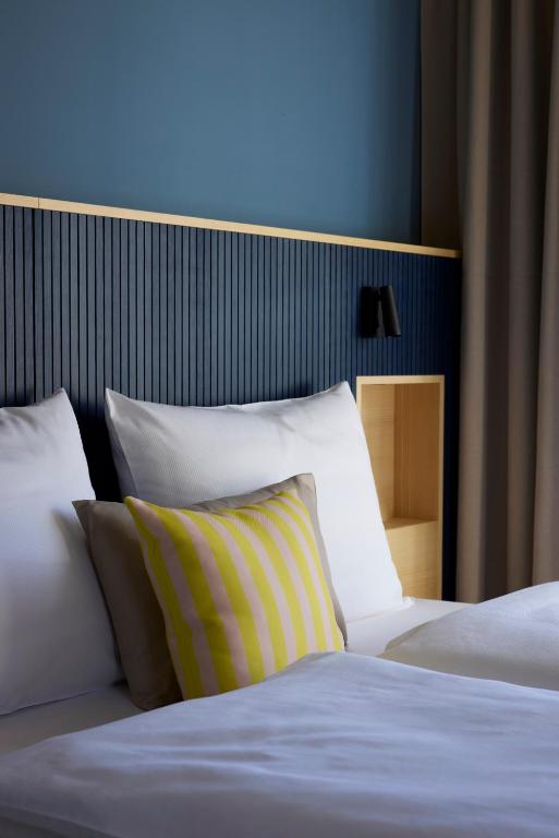 Postel nebo postele na pokoji v ubytování Hotel UND - smart alpine stay