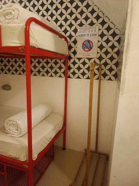 Postel nebo postele na pokoji v ubytování goSTOPS Lite Kochi