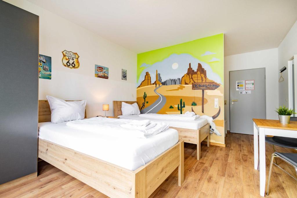Postel nebo postele na pokoji v ubytování StayInn Hostel und Gästehaus