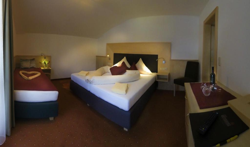 Posteľ alebo postele v izbe v ubytovaní Hotel Unser Unterberg