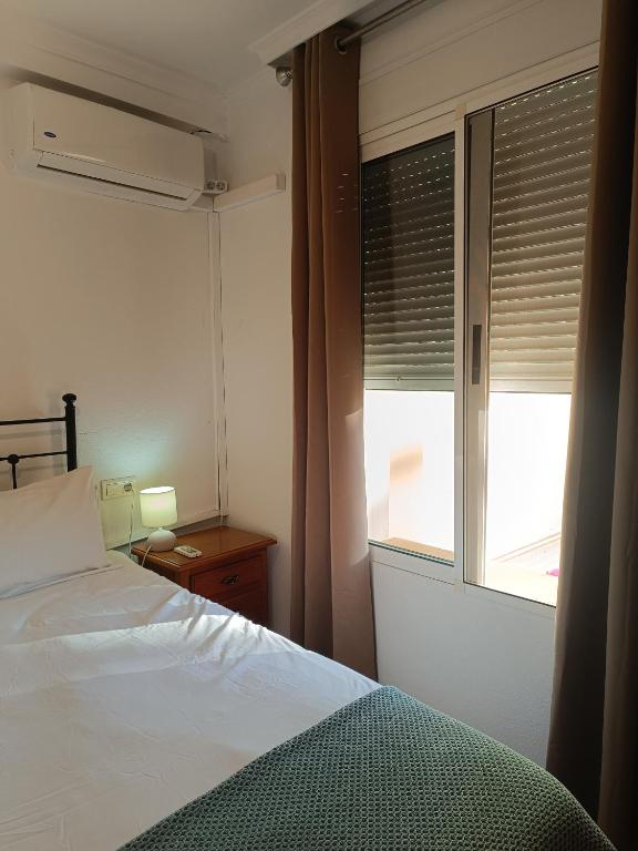 Postel nebo postele na pokoji v ubytování Bahía de Vera Apartamento Luisa