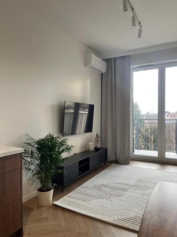 Postel nebo postele na pokoji v ubytování Apartament N13