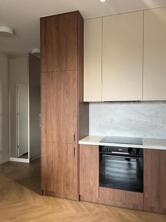 Kuchyň nebo kuchyňský kout v ubytování Apartament N13