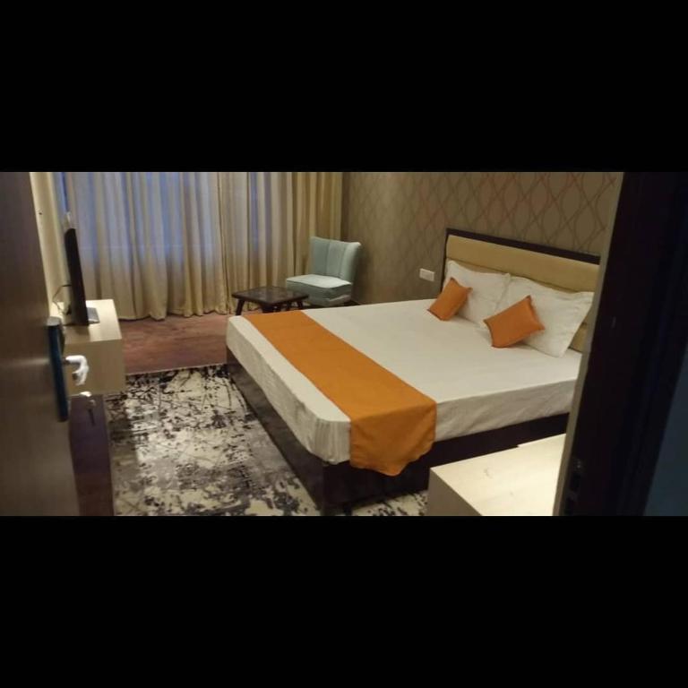 Letto o letti in una camera di The Royal Residence Inn
