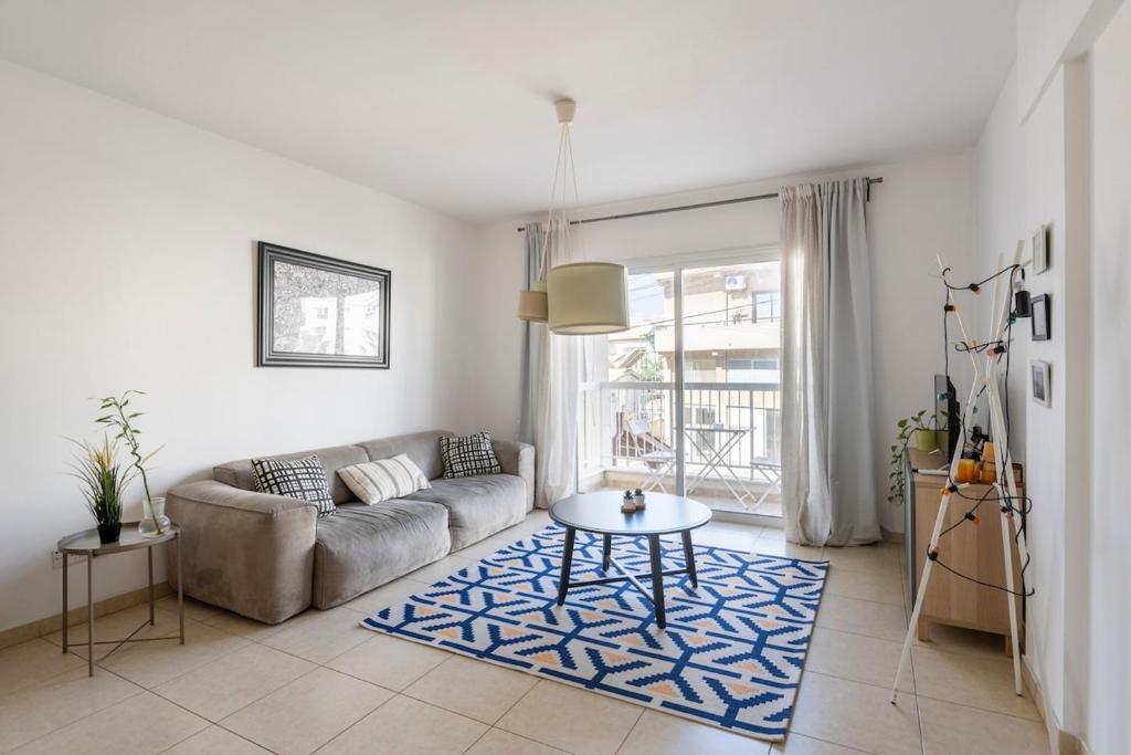 a living room with a couch and a table at Center, Walking to the Beach in Larnaka