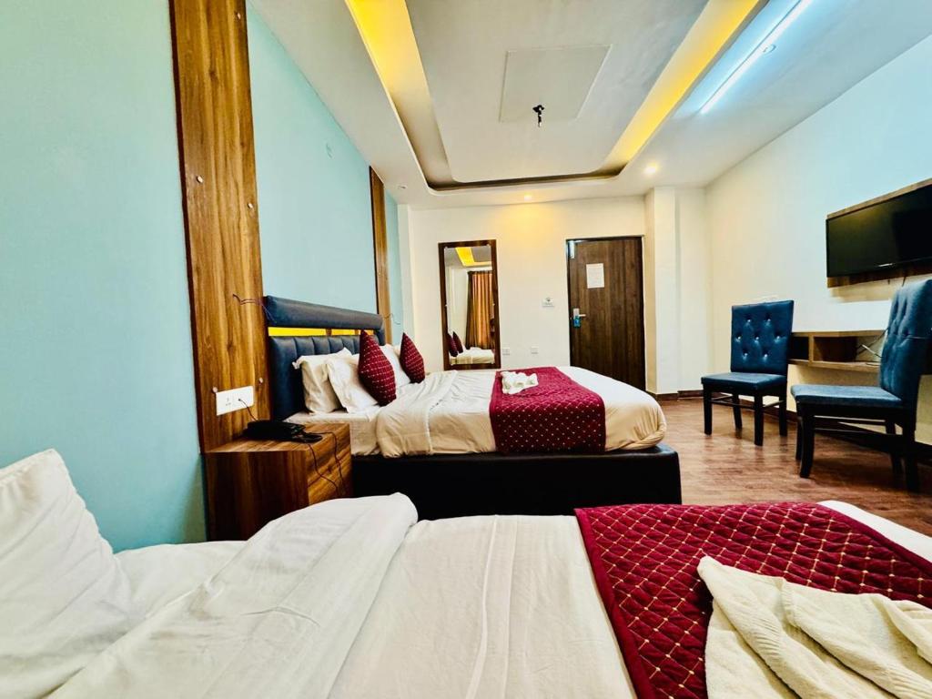 Letto o letti in una camera di The Royal Residence Inn