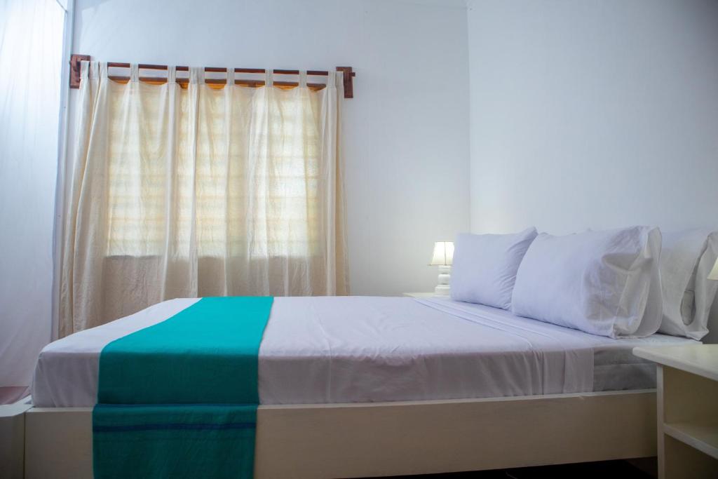 Postel nebo postele na pokoji v ubytování Gabsgate Resort