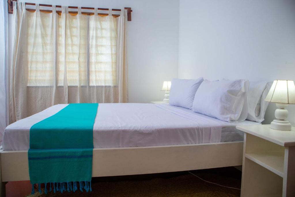 Postel nebo postele na pokoji v ubytování Gabsgate Resort