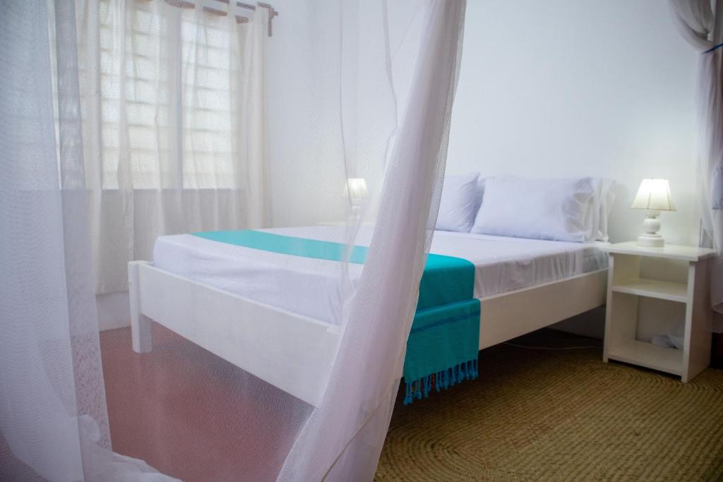 Postel nebo postele na pokoji v ubytování Gabsgate Resort