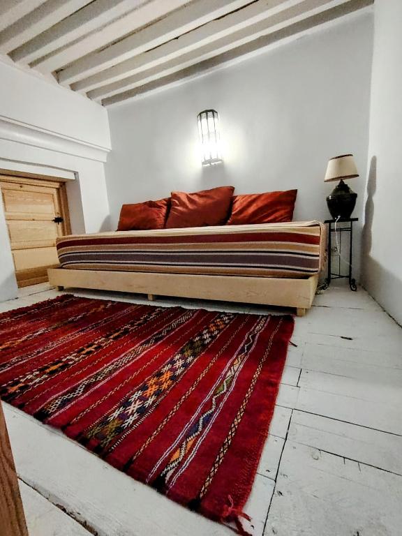 Postel nebo postele na pokoji v ubytování La Maison des Amis