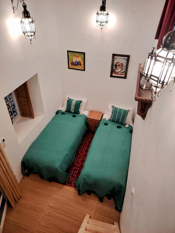 Postel nebo postele na pokoji v ubytování La Maison des Amis