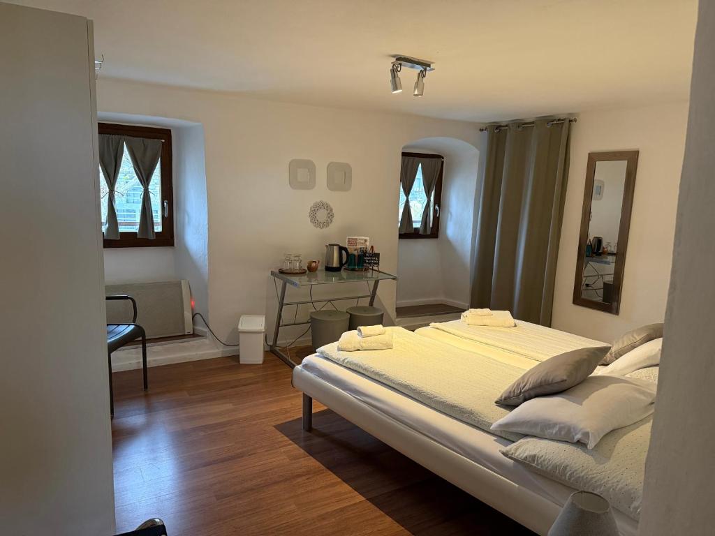 Postel nebo postele na pokoji v ubytování B&B ALLA PIAZZETTA DI TEGNA