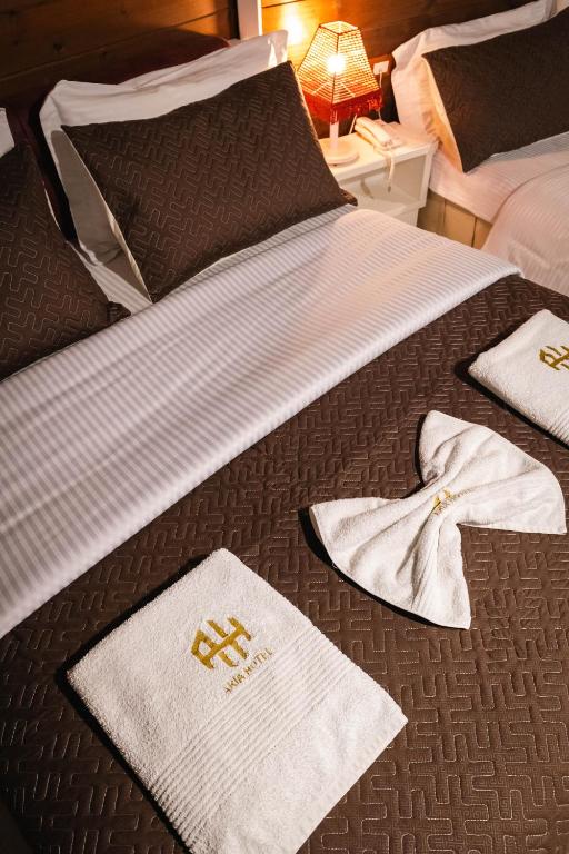 Postel nebo postele na pokoji v ubytování Hotel Aria