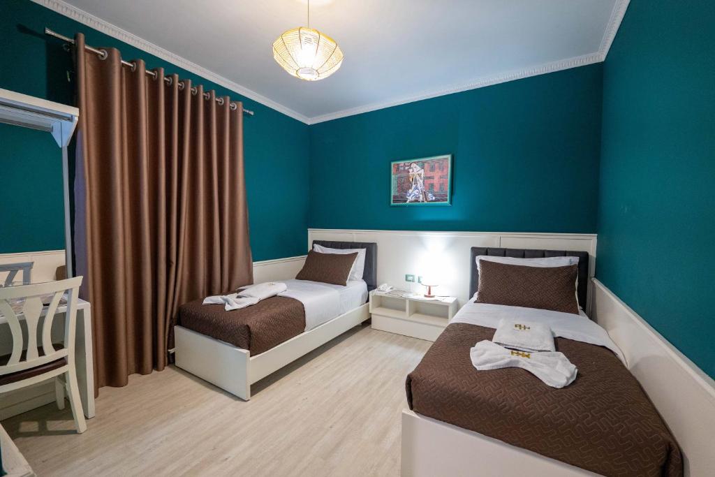 Postel nebo postele na pokoji v ubytování Hotel Aria